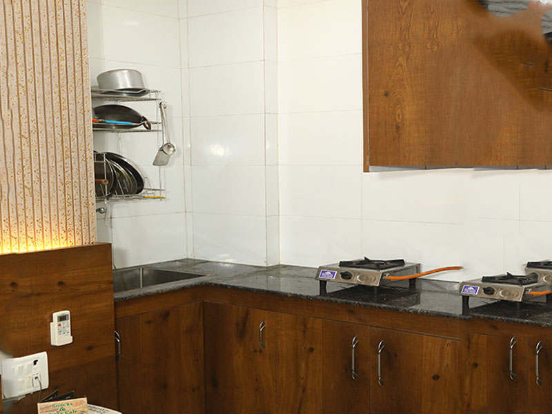 Hotel room with private kitchenette and self-cooking facility near Max Super Speciality Hospital